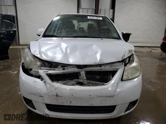 2011 Suzuki SX4 LE z VIN JS2YC5A29B6302397, wystawiony jako Copart lot #82691304 z przebiegiem 251 382 mil mil oraz Szkoda całkowita • Salvage title. Historia ofert i sprzedaży dostępna na DreamBid. Obrazek 5.