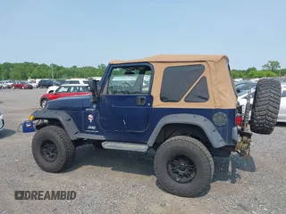 2006 Jeep Wrangler Sport z VIN 1J4FA49S66P708332, wystawiony jako IAAI lot #42402995 z przebiegiem 130 795 mil mil oraz . Historia ofert i sprzedaży dostępna na DreamBid. Obrazek 14.