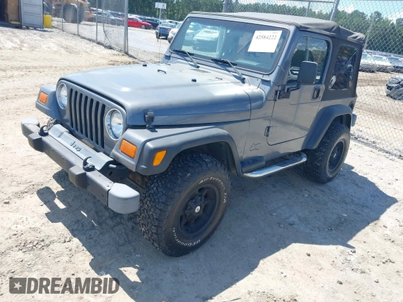 2002 Jeep Wrangler Sport z VIN 1J4FA49S62P731507, wystawiony jako IAAI lot #42584222 z przebiegiem 206 661 mil mil oraz . Historia ofert i sprzedaży dostępna na DreamBid. Obrazek 2.