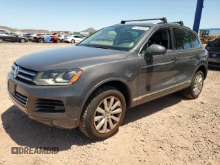 2012 Volkswagen Touareg Sport с VIN WVGFK9BPXCD003600, выставлен на аукционе Copart как лот 61783705 с пробегом 171 598 миль миль и Чистый • Clean title. История ставок и продаж доступна на DreamBid. Изображение 1.