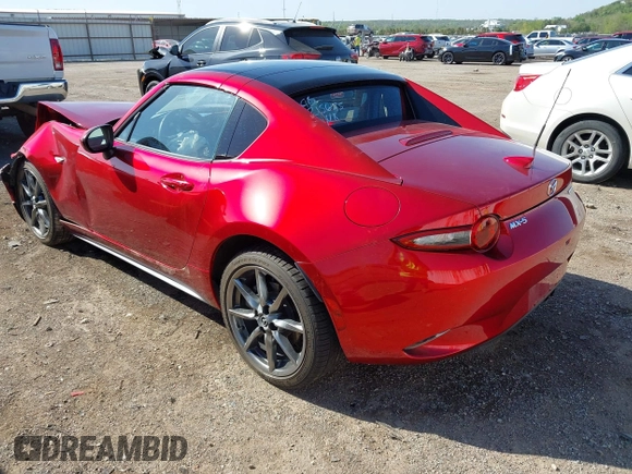 2020 Mazda MX-5 Miata Grand Touring z VIN JM1NDAM77L0418499, wystawiony jako IAAI lot #42010802 z przebiegiem 19 588 mil mil oraz . Historia ofert i sprzedaży dostępna na DreamBid. Obrazek 3.