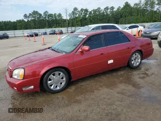 2004 Cadillac DeVille DTS z VIN 1G6KF57984U165398, wystawiony jako Copart lot #67197564 z przebiegiem 156 578 mil mil oraz Szkody całkowita. Historia ofert i sprzedaży dostępna na DreamBid. Obrazek 1.