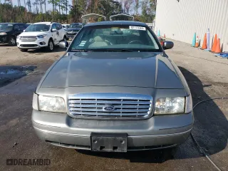 2000 Ford Crown Victoria with VIN 2FAFP73W0YX173874, listed as a Copart auction lot 82113564 with 108,425 mi miles and Salvage Title. Bid and sale history available at carsss.com. Image 5.