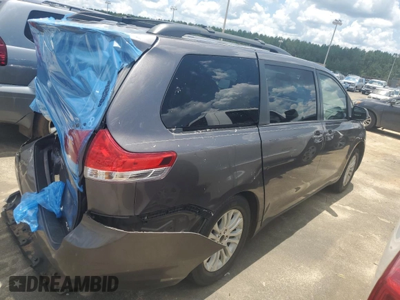 2012 Toyota Sienna XLE AAS with VIN 5TDYK3DC1CS279575, listed as a Copart auction lot 60350235 with 275,287 mi miles and Salvage title. Bid and sale history available at DreamBid. Image 3.
