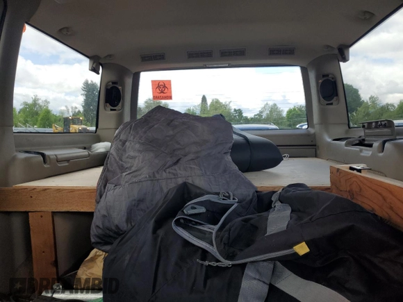 2001 GMC Safari z VIN 1GKEL19W61B514522, wystawiony jako Copart lot #57143155 z przebiegiem Nie podano mil oraz Szkoda całkowita • Salvage title. Historia ofert i sprzedaży dostępna na DreamBid. Obrazek 10.