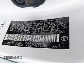 2021 Toyota Prius L Eco with VIN JTDKAMFU2M3147562, listed as a IAAI auction lot 41882066 with 99,491 mi miles. Bid and sale history available at carsss.com. Image 9.