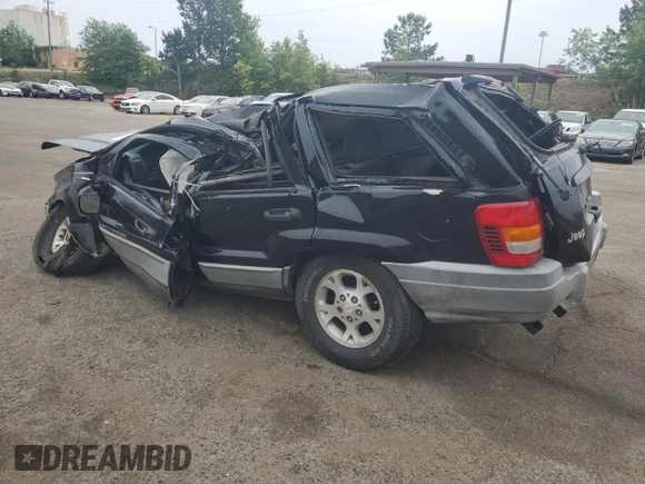 2000 Jeep Grand Cherokee Laredo with VIN 1J4G248S4YC390675, listed as a Copart auction lot 55652815 with Not provided miles and Salvage title. Bid and sale history available at DreamBid. Image 2.