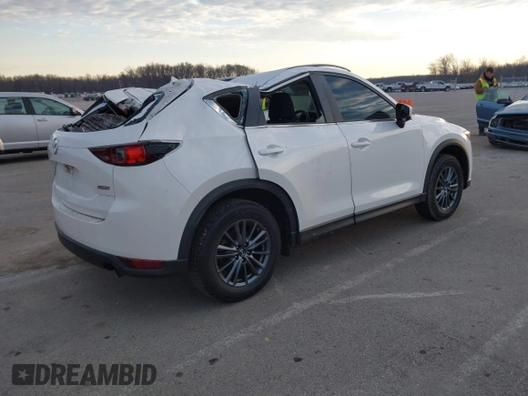 2019 Mazda CX-5 Sport with VIN JM3KFABMXK1655302, listed as a IAAI auction lot 41901293 with 140,369 mi miles and . Bid and sale history available at DreamBid. Image 4.