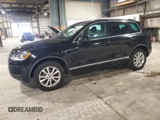 2014 Volkswagen Touareg Sport z VIN WVGEF9BPXED005642, wystawiony jako Copart lot #59632375 z przebiegiem 150 196 mil mil oraz Czysty tytuł • Clean title. Historia ofert i sprzedaży dostępna na DreamBid. Obrazek 1.