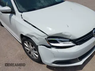 2014 Volkswagen Jetta SE with VIN 3VWD07AJXEM333132, listed as a IAAI auction lot 42637022 with 157,113 mi miles and . Bid and sale history available at DreamBid. Image 6.