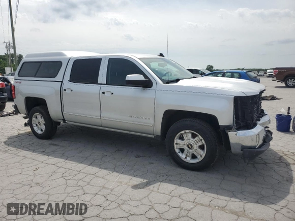 2017 Chevrolet Silverado 1500 LT with VIN 3GCUKREC3HG320455, listed as a Copart auction lot 57124395 with 119,683 mi miles and Salvage Title. Bid and sale history available at DreamBid. Image 4.