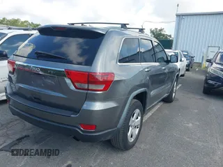 2011 Jeep Grand Cherokee Laredo with VIN 1J4RR4GG7BC736694, listed as a IAAI auction lot 42758461 with 159,875 mi miles and . Bid and sale history available at DreamBid. Image 4.