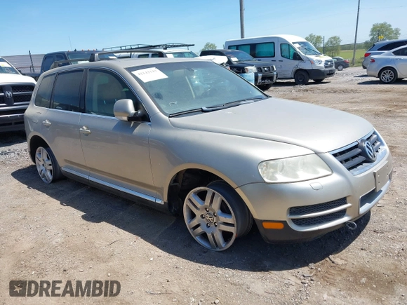 2004 Volkswagen Touareg with VIN WVGCM67L44D033856, listed as a IAAI auction lot 42142143 with 105,682 mi miles and . Bid and sale history available at DreamBid. Image 1.