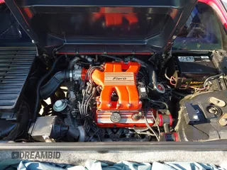 1986 Pontiac Fiero z VIN 1G2PG9791GP267415, wystawiony jako IAAI lot #42461769 z przebiegiem Nie podano mil oraz . Historia ofert i sprzedaży dostępna na DreamBid. Obrazek 10.