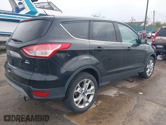 2013 Ford Escape SEL with VIN 1FMCU9H93DUC79592, listed as a IAAI auction lot 42039037 with 63,020 mi miles and . Bid and sale history available at DreamBid. Image 4.