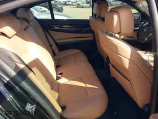 2012 BMW 7 Series 740i with VIN WBAKA4C51CC613636, listed as a IAAI auction lot 41908801 with 127,725 mi miles. Bid and sale history available at carsss.com. Image 8.