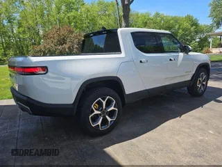 2023 Rivian R1T Adventure z VIN 7FCTGAAA1PN020478, wystawiony jako IAAI lot #42361936 z przebiegiem 443 mil mil oraz . Historia ofert i sprzedaży dostępna na DreamBid. Obrazek 4.
