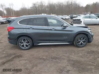 2017 BMW X1 xDrive28i with VIN WBXHT3C35H5F74213, listed as a IAAI auction lot 41589180 with 58,990 mi miles. Bid and sale history available at carsss.com. Image 12.