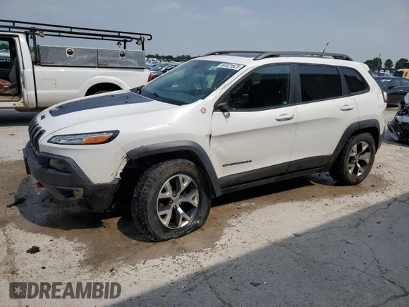 2015 Jeep Cherokee Trailhawk with VIN 1C4PJMBS8FW717950, listed as a Copart auction lot 60321625 with 155,210 mi miles and Salvage title. Bid and sale history available at DreamBid. Image 1.