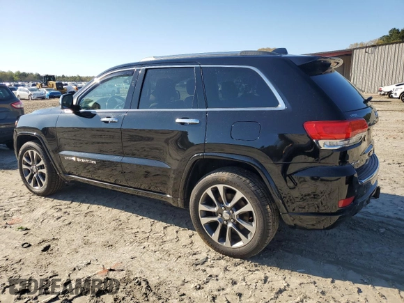 2017 Jeep Grand Cherokee Overland with VIN 1C4RJFCT3HC755960, listed as a Copart auction lot 52268895 with 99,998 mi miles and Salvage title. Bid and sale history available at DreamBid. Image 2.
