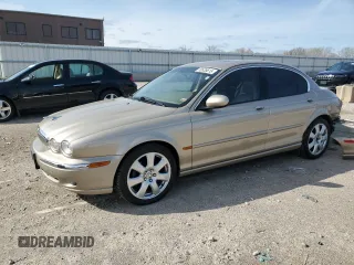2004 Jaguar X-Type with VIN SAJEA51C64WD66013, listed as a Copart auction lot 50635615 with 47,365 mi miles and Salvage Title. Bid and sale history available at carsss.com. Image 1.