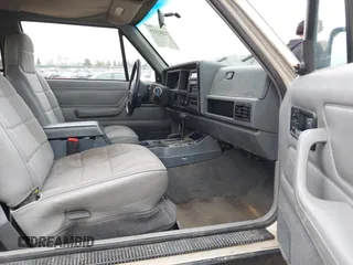 1996 Jeep Cherokee Sport with VIN 1J4FJ67S4TL224743, listed as a IAAI auction lot 42083533 with 253,847 mi miles. Bid and sale history available at carsss.com. Image 5.
