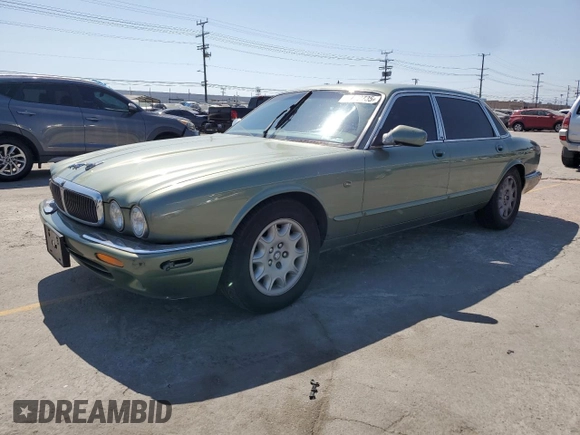 1999 Jaguar XJ with VIN SAJHX604XXC854217, listed as a Copart auction lot 56042735 with 127,092 mi miles and Salvage title. Bid and sale history available at DreamBid. Image 1.