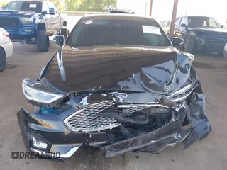 2020 Ford Fusion Titanium with VIN 3FA6P0RU8LR141324, listed as a IAAI auction lot 42004026 with 107,136 mi miles and . Bid and sale history available at DreamBid. Image 12.