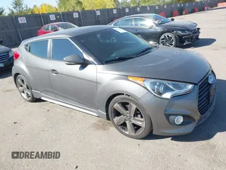 2013 Hyundai Veloster Turbo with VIN KMHTC6AE0DU083862, listed as a IAAI auction lot 40600413 with 92,875 mi miles and . Bid and sale history available at DreamBid. Image 1.