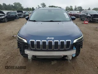 2019 Jeep Cherokee Latitude with VIN 1C4PJLCB9KD412004, listed as a Copart auction lot 61642015 with 121,336 mi miles and Salvage title. Bid and sale history available at DreamBid. Image 5.