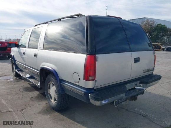 1997 Chevrolet Suburban with VIN 1GNFK16R2VJ365448, listed as a IAAI auction lot 41689906 with 228,151 mi miles. Bid and sale history available at carsss.com. Image 3.
