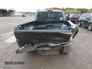 2005 Mazda B-Series Truck SE with VIN 4F4ZR47E15PM05750, listed as a IAAI auction lot 41850056 with 163,605 mi miles and . Bid and sale history available at DreamBid. Image 16.