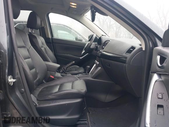 2014 Mazda CX-5 Grand Touring with VIN JM3KE4DY0E0392476, listed as a IAAI auction lot 41419144 with 89,245 mi miles and . Bid and sale history available at carsss.com. Image 5.