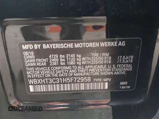 2017 BMW X1 xDrive28i with VIN WBXHT3C31H5F72958, listed as a IAAI auction lot 41782257 with 134,829 mi miles. Bid and sale history available at carsss.com. Image 9.