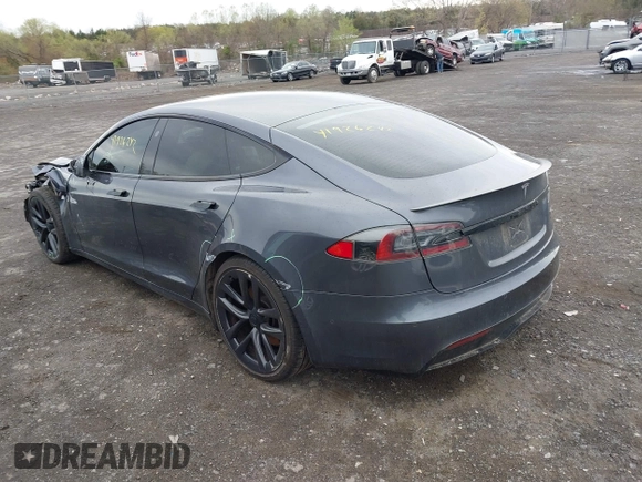 2021 Tesla Model S Long Range with VIN 5YJSA1E5XMF428519, listed as a IAAI auction lot 41926242 with 54,284 mi miles and . Bid and sale history available at DreamBid. Image 3.
