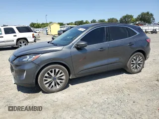 2020 Ford Escape Titanium Hybrid with VIN 1FMCU9DZ4LUA79387, listed as a Copart auction lot 62174835 with 82,486 mi miles and Salvage title. Bid and sale history available at DreamBid. Image 1.