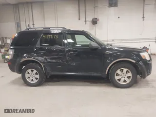 2010 Mercury Mariner with VIN 4M2CN9BG0AKJ06493, listed as a IAAI auction lot 41199173 with 143,631 mi miles. Bid and sale history available at carsss.com. Image 14.