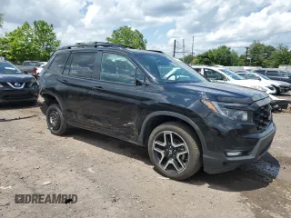 2023 Honda Passport Elite with VIN 5FNYF8H01PB030270, listed as a Copart auction lot 61402965 with 7,931 mi miles and Salvage title. Bid and sale history available at DreamBid. Image 4.