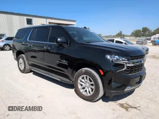2023 Chevrolet Suburban LS with VIN 1GNSCBKD1PR132161, listed as a Copart auction lot 70649614 with 24,850 mi miles and Salvage Title. Bid and sale history available at DreamBid. Image 4.