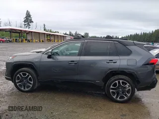 2021 Toyota RAV4 Hybrid XSE with VIN 2T3E6RFV4MW004081, listed as a IAAI auction lot 42300195 with 63,238 mi miles and . Bid and sale history available at DreamBid. Image 14.
