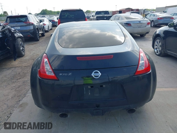 2015 Nissan 370Z z VIN JN1AZ4EH2FM442556, wystawiony jako IAAI lot #41956287 z przebiegiem 128 769 mil mil oraz . Historia ofert i sprzedaży dostępna na DreamBid. Obrazek 17.