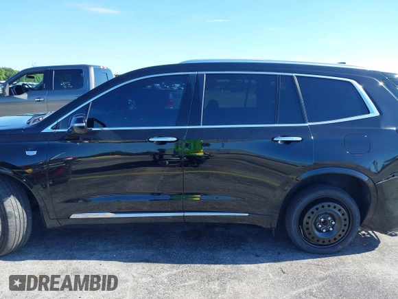 2020 Cadillac XT6 FWD Premium Luxury with VIN 1GYKPCRS7LZ211197, listed as a IAAI auction lot 42231424 with 57,351 mi miles and . Bid and sale history available at DreamBid. Image 14.