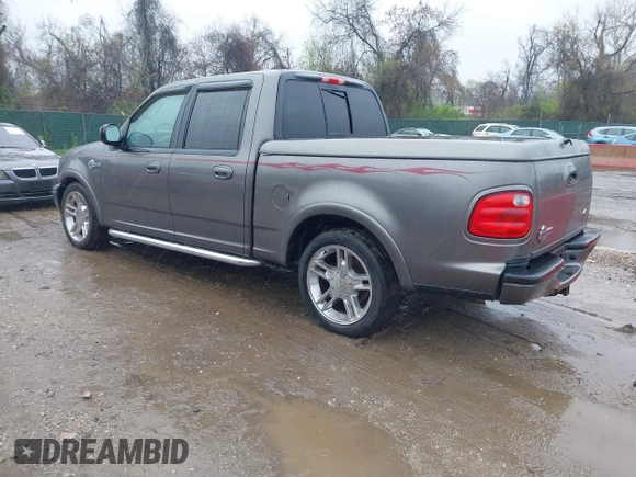 2002 Ford F-150 Harley Davidson with VIN 1FTRW07392KD29874, listed as a IAAI auction lot 41974230 with 163,279 mi miles. Bid and sale history available at carsss.com. Image 3.