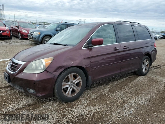 2010 Honda Odyssey Touring with VIN 5FNRL3H94AB056657, listed as a Copart auction lot 72658934 with 202,690 mi miles and Salvage title. Bid and sale history available at DreamBid. Image 1.