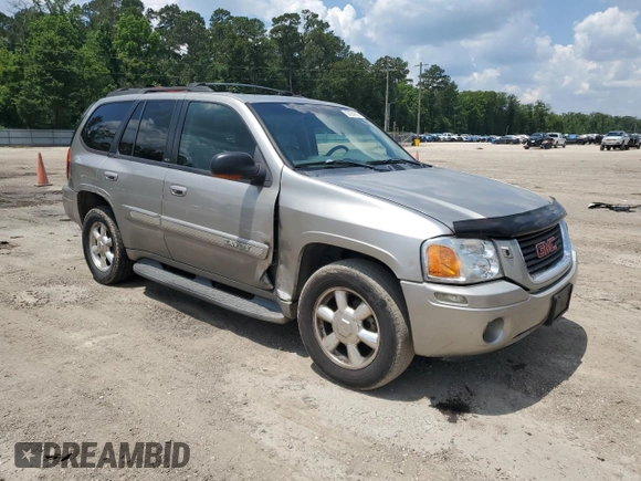 2002 GMC Envoy SLT z VIN 1GKDS13S922263923, wystawiony jako Copart lot #59234395 z przebiegiem Nie podano mil oraz Szkoda całkowita • Salvage title. Historia ofert i sprzedaży dostępna na DreamBid. Obrazek 4.