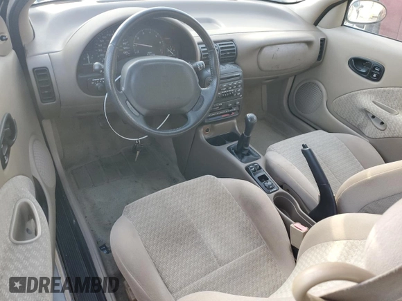 1999 Saturn SC z VIN 1G8ZR1275XZ375833, wystawiony jako Copart lot #87960885 z przebiegiem 97 697 mil mil oraz Szkody całkowita. Historia ofert i sprzedaży dostępna na DreamBid. Obrazek 8.