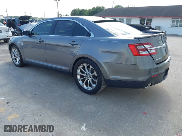2014 Ford Taurus Limited with VIN 1FAHP2F89EG102814, listed as a IAAI auction lot 41999304 with 254,644 mi miles. Bid and sale history available at carsss.com. Image 3.