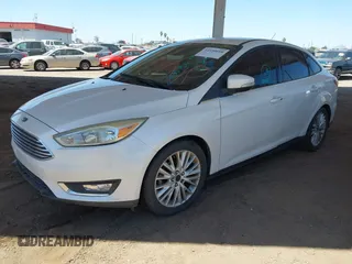 2015 Ford Focus Titanium with VIN 1FADP3J28FL256155, listed as a IAAI auction lot 42350610 with 53,840 mi miles and . Bid and sale history available at DreamBid. Image 2.