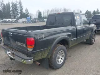 1999 Mazda B-Series 4WD Truck SE with VIN 4F4ZR17X5XTM17667, listed as a IAAI auction lot 41896804 with 101,596 mi miles. Bid and sale history available at carsss.com. Image 4.
