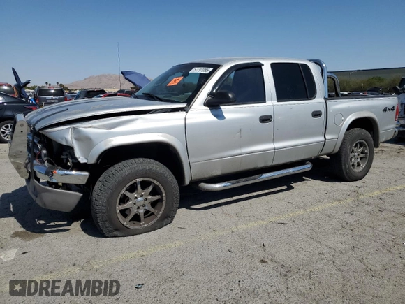 2004 Dodge Dakota SLT with VIN 1D7HG48N74S509797, listed as a Copart auction lot 57797055 with 214,275 mi miles and Salvage title. Bid and sale history available at DreamBid. Image 1.